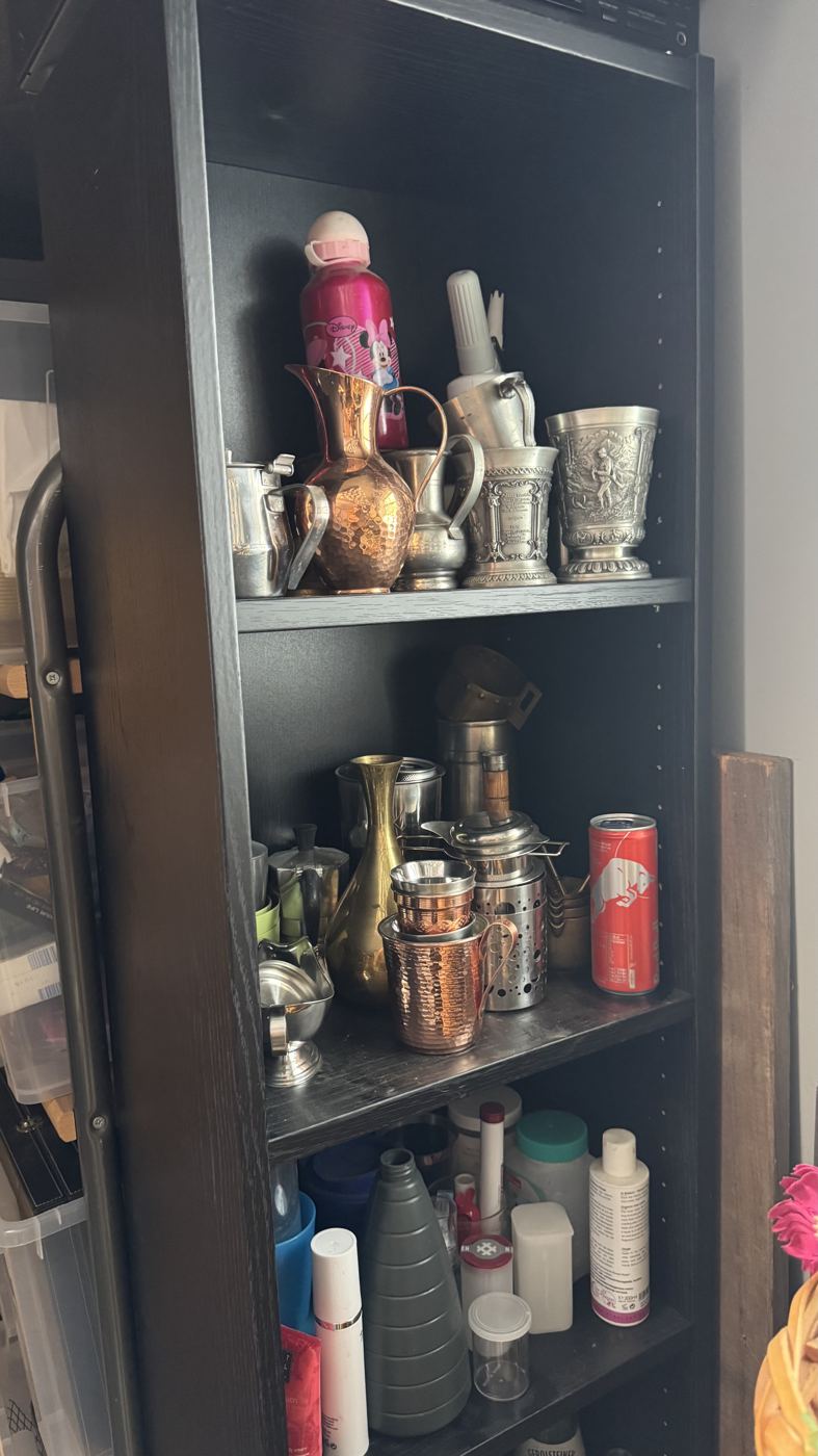 Shelf of bottles and metal props